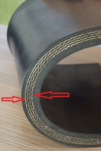 How does the bending of EP fabric affect the working life of the conveyor belt?